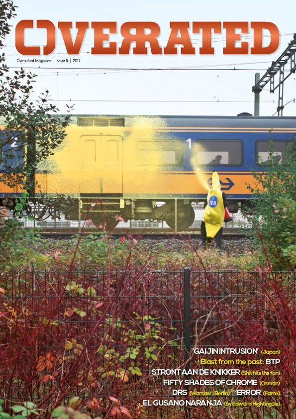 The cover of Overrated Magazine issue #5 showing a banana using a fire extinguisher with yellow paint on a Dutch intercity