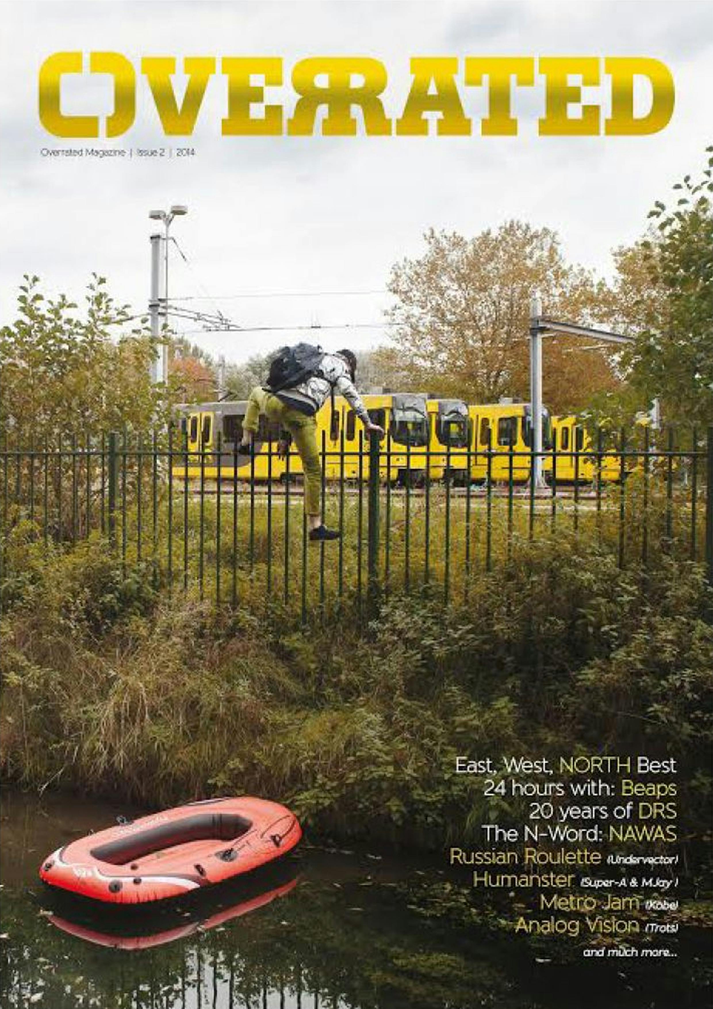 The cover of Overrated Magazine issue #2 showing someone climbing the fence of a tram yard after crossing a canal with an inflatable boat